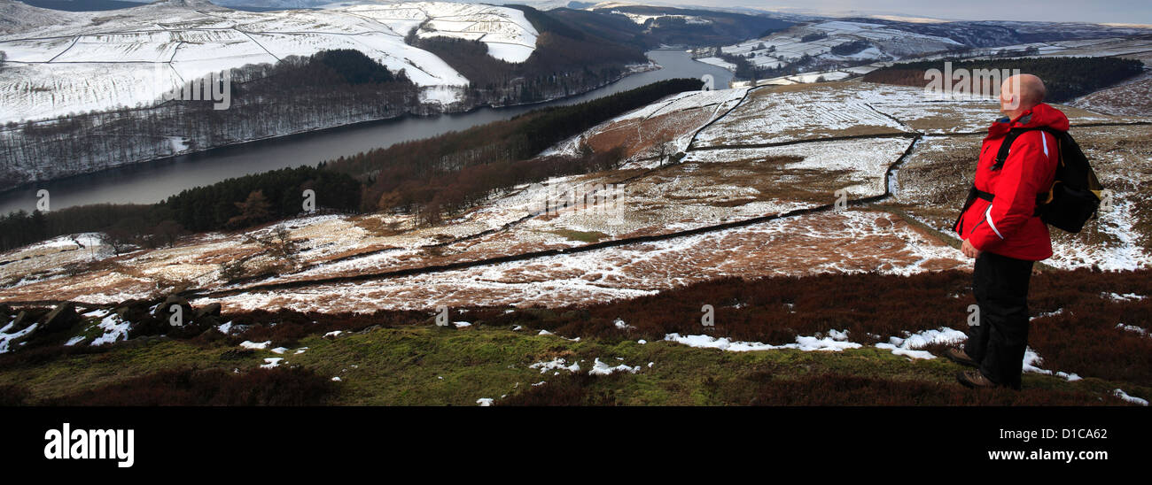 Adult male walker overlooking Ladybower reservoir, Wintertime, Upper Derwent Valley, Peak District National Park, Derbyshire Stock Photo