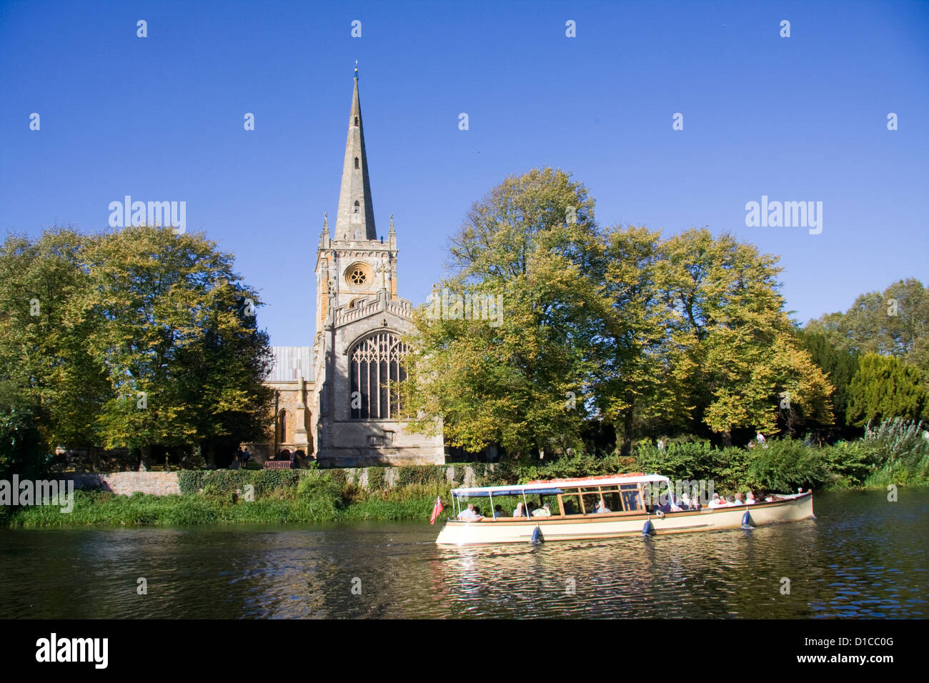 Holy Trinity Church from River with boat Stratford upon Avon Warwickshire England UK Stock Photo