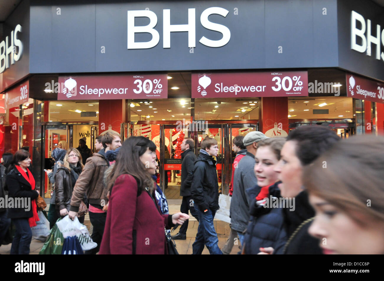 Oxford Street, London, UK. 15th December 2012. Christmas shoppers walk past BHS Sale signs.  Central London is filled with Christmas shoppers on the busiest shopping weekend of the year. Credit:  Matthew Chattle / Alamy Live News Stock Photo