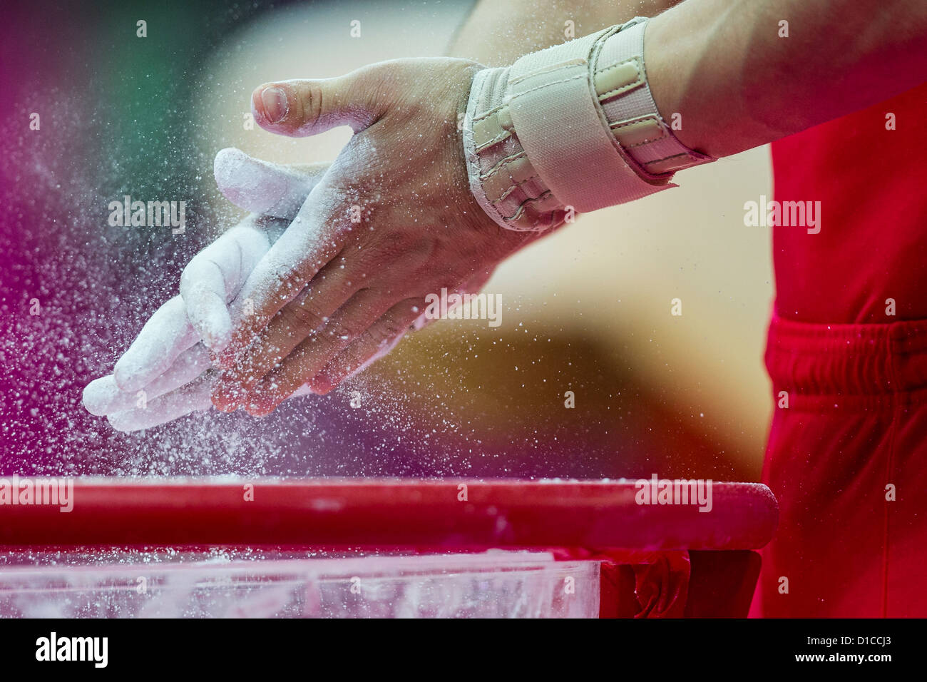 Detail of male gymnasts hands applying chalk during the Men's Gymnastics Individual AllAround