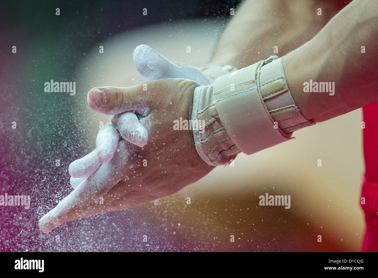 Detail of male gymnasts hands applying chalk during the Men's