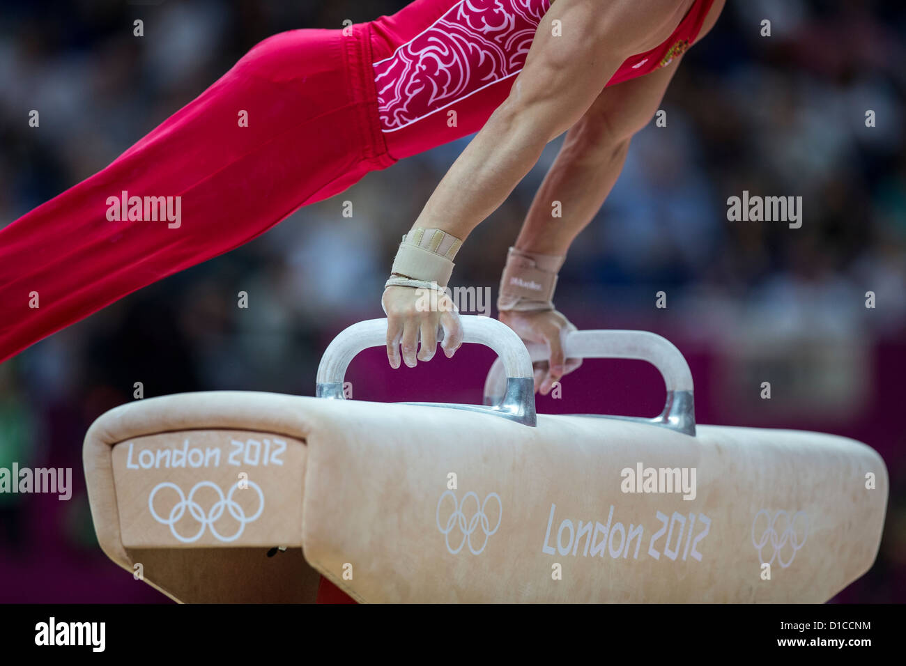 Detail of male gymnast's hands on the pommel horse during the Men's