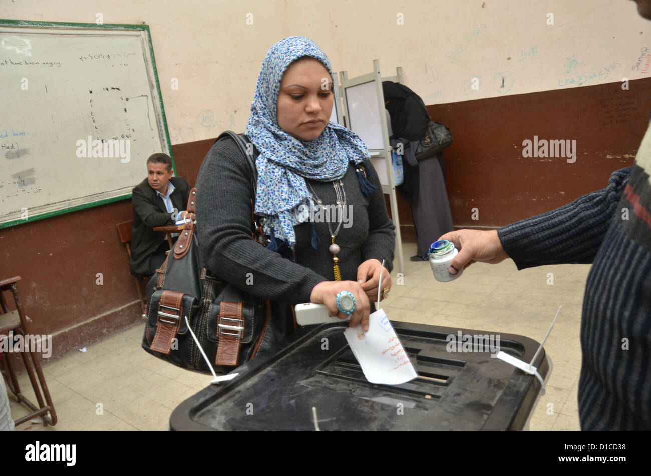 Egyptians go to the polls to vote on the controversial Islamist backed constitutional referendum that will chart its future. Stock Photo