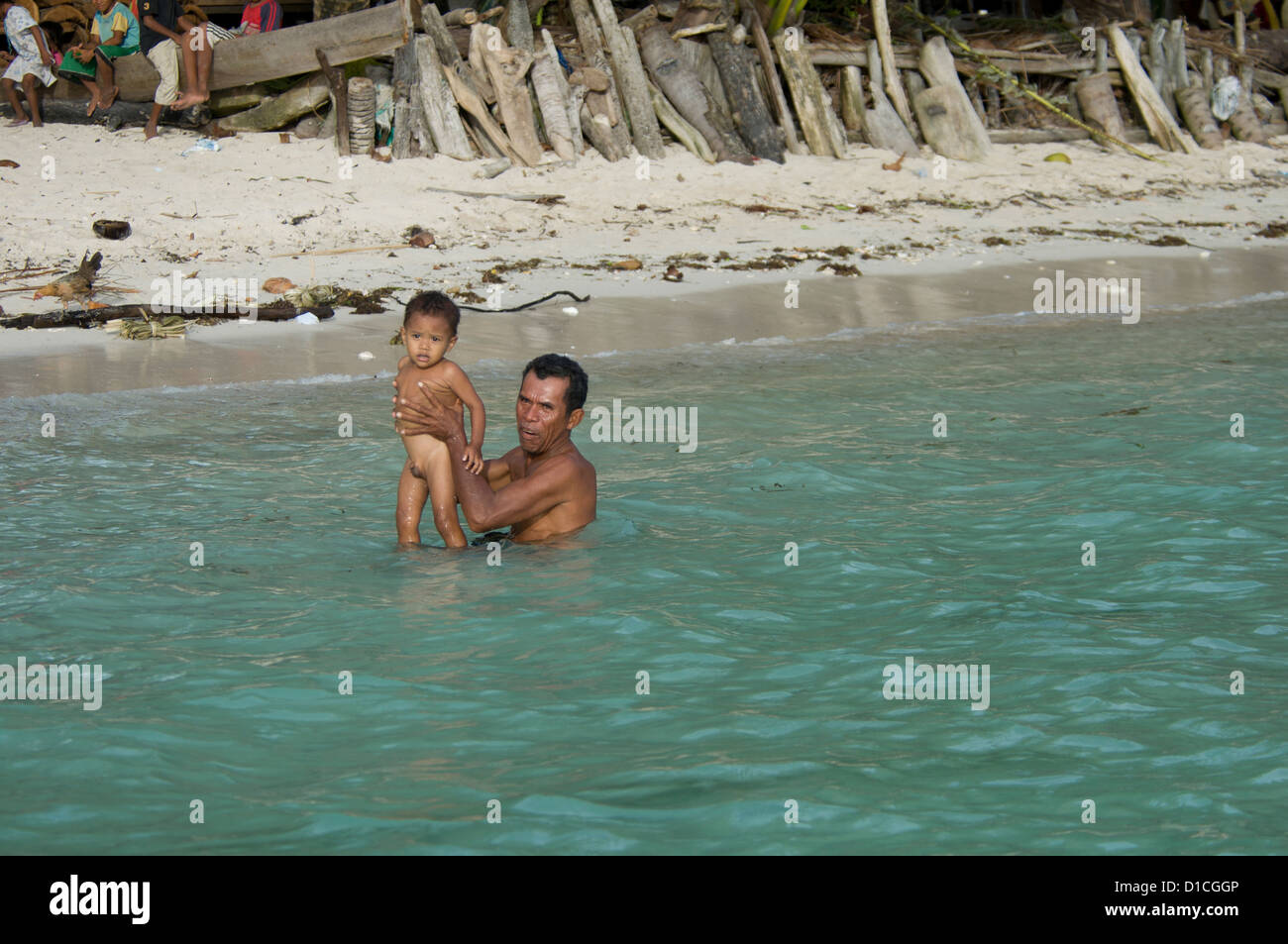 Indonesian father and son, Ceram, Spice Islands, Maluku Region, Halmahera, Indonesia, Pacific Ocean (No MR) Stock Photo