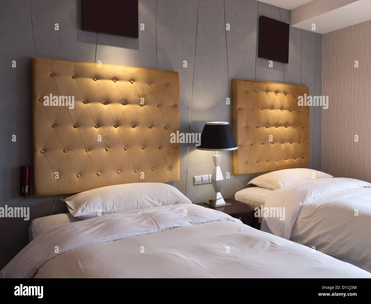 Twin beds in hotel room Stock Photo