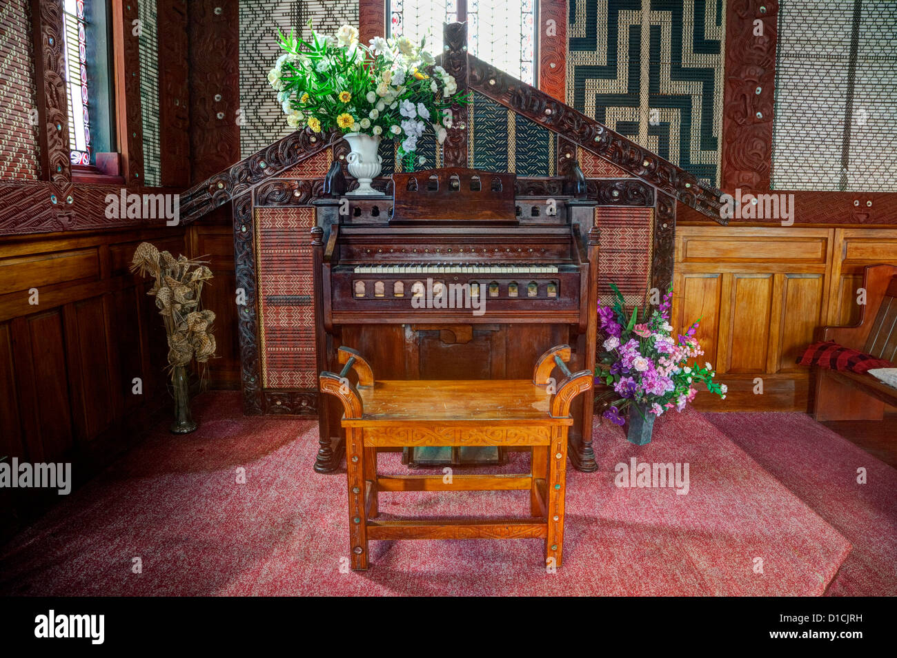 Cultural Syncretism. Church organ framed in woodwork similar to a wharenui (Maori meeting house). Stock Photo