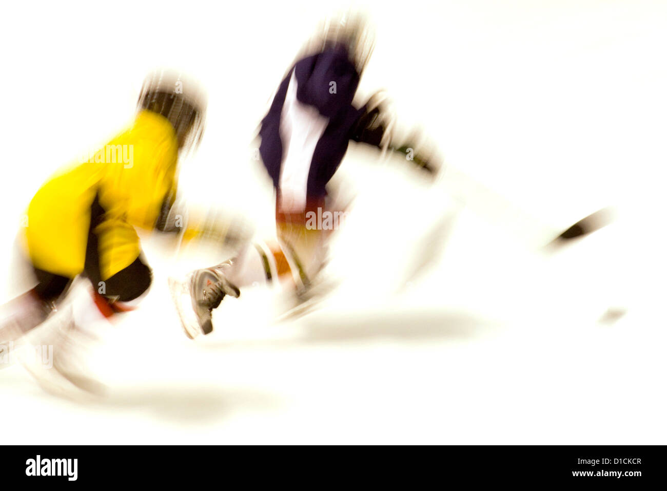 Blurred action of boys age 10 playing hockey. Maplewood Minnesota MN USA Stock Photo