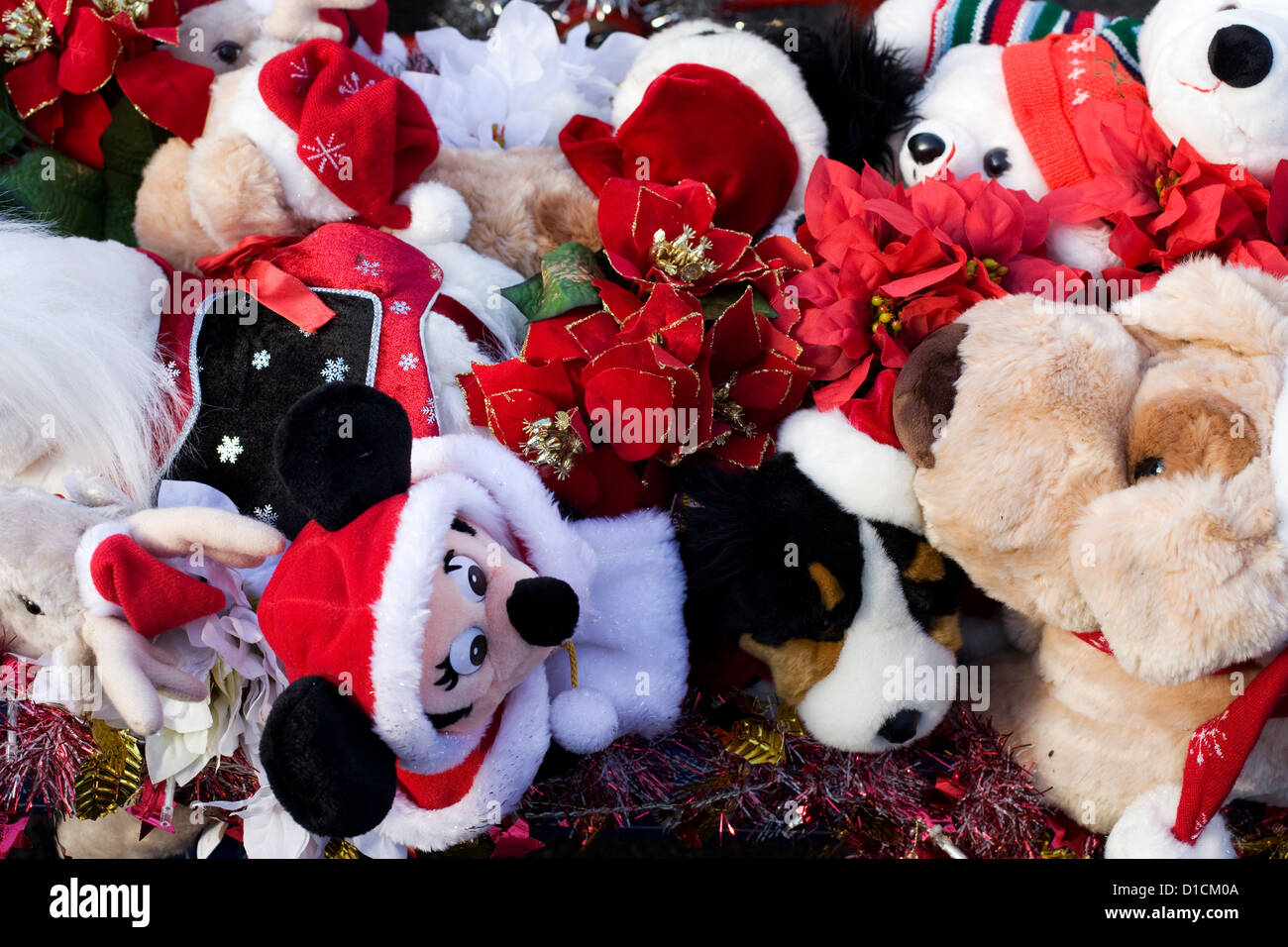 Different types of Cuddly Christmas Toys in a basket Stock Photo