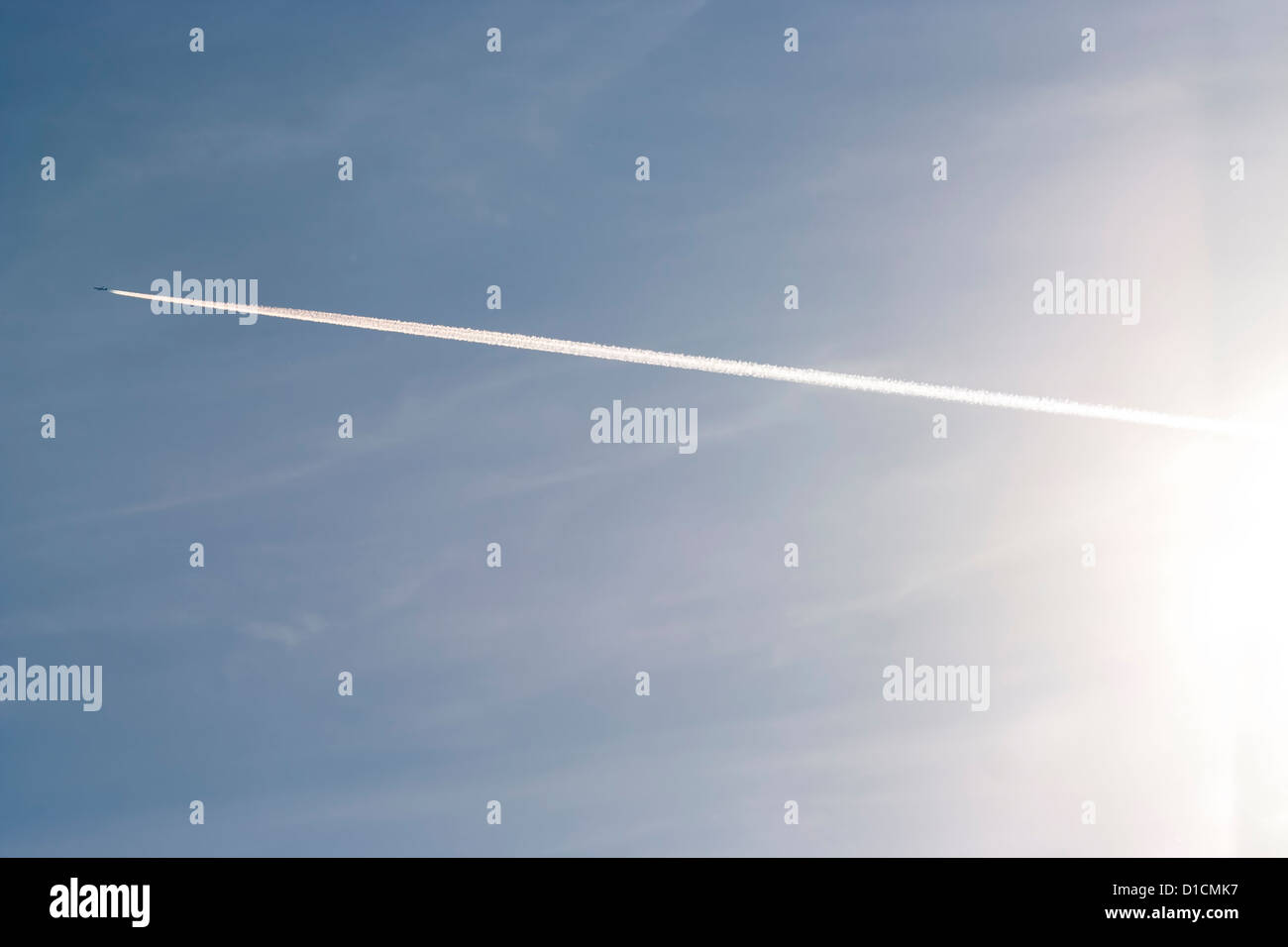 flying air plane on blue sky Stock Photo - Alamy