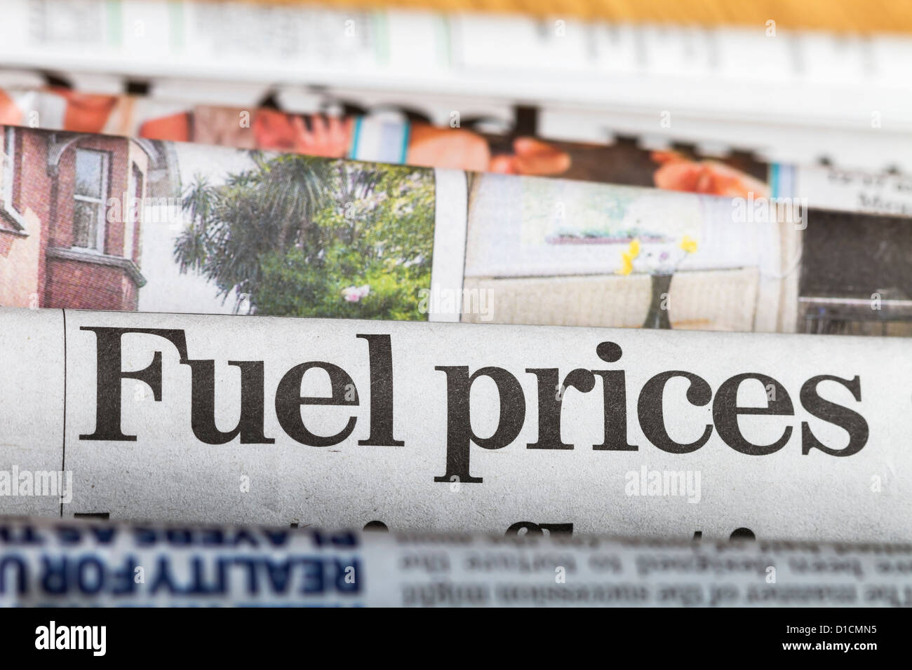 Newspapers stacked up with headline about fuel prices in the center of the image. Stock Photo