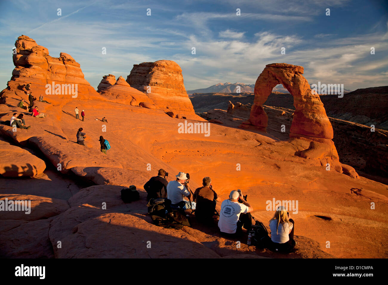 tourists and photographers at Delicate Arch, symbol of Utah, Arches National Park just outside of Moab, Utah, USA Stock Photo