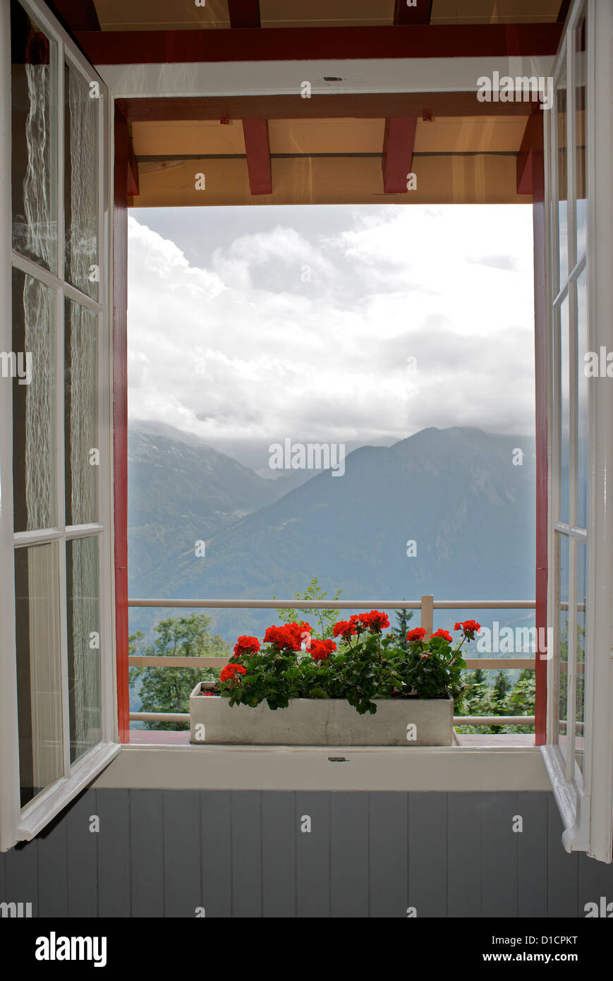 Open window looking out to mountains Stock Photo