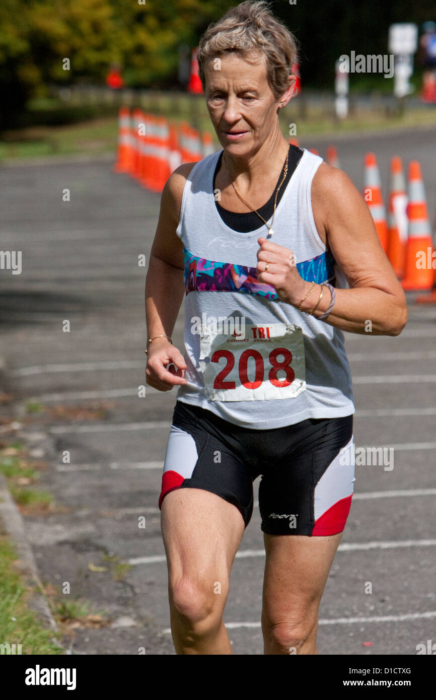 Physical Fitness. Triathlon Runner, Blue Lake, Rotorua, New Zealand. Stock Photo