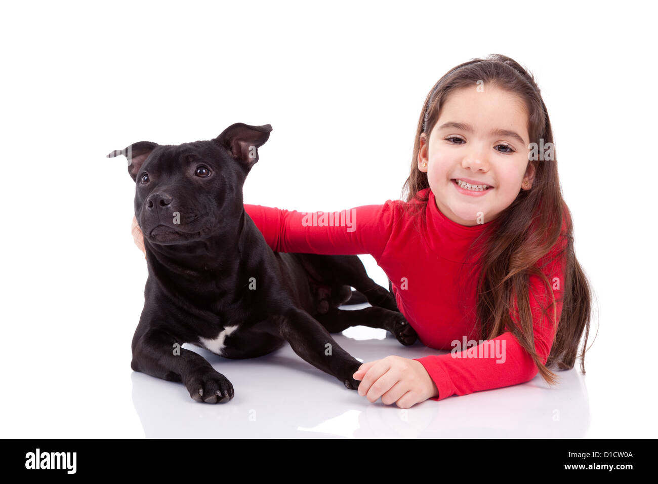 Little caucasian girl with her pet, isolated on white background Stock Photo
