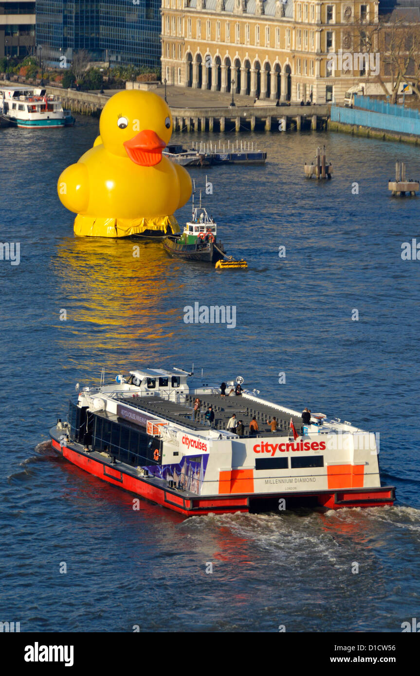Yellow duck on River Thames promoting the Jackpotjoy bingo website with tour boat Stock Photo