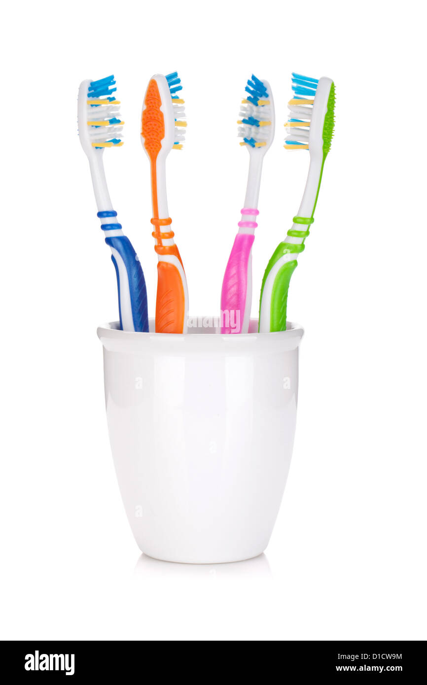 Four colorful toothbrushes. Isolated on white background Stock Photo ...