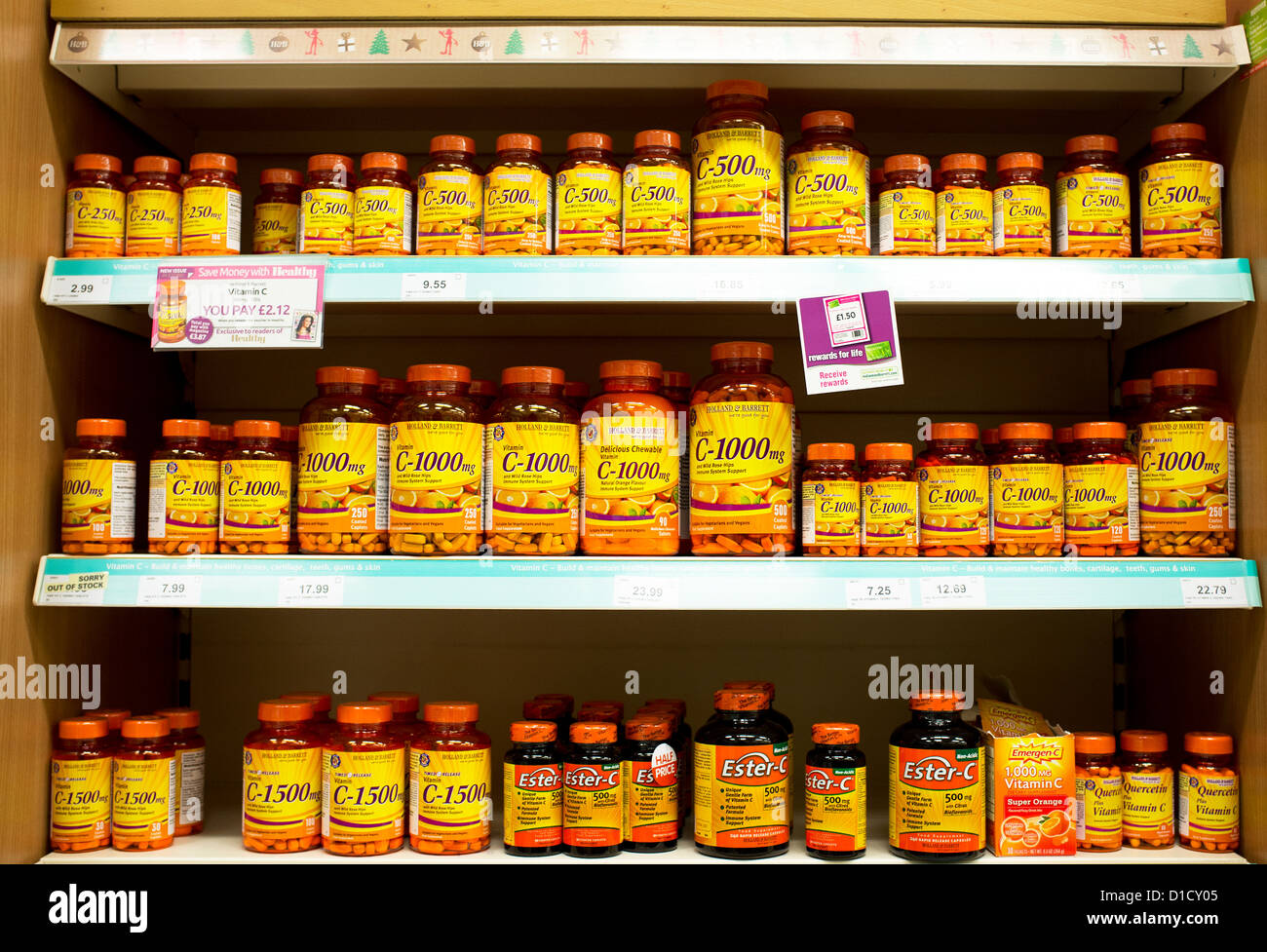 Shelves full of containers Vitamin C tablets. Stock Photo