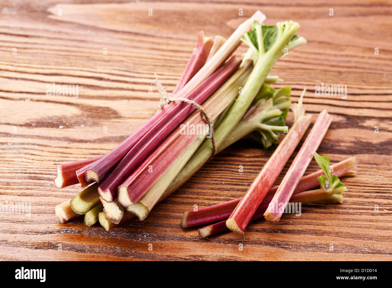 Rhubarb stalks on a wooden table. Stock Photo