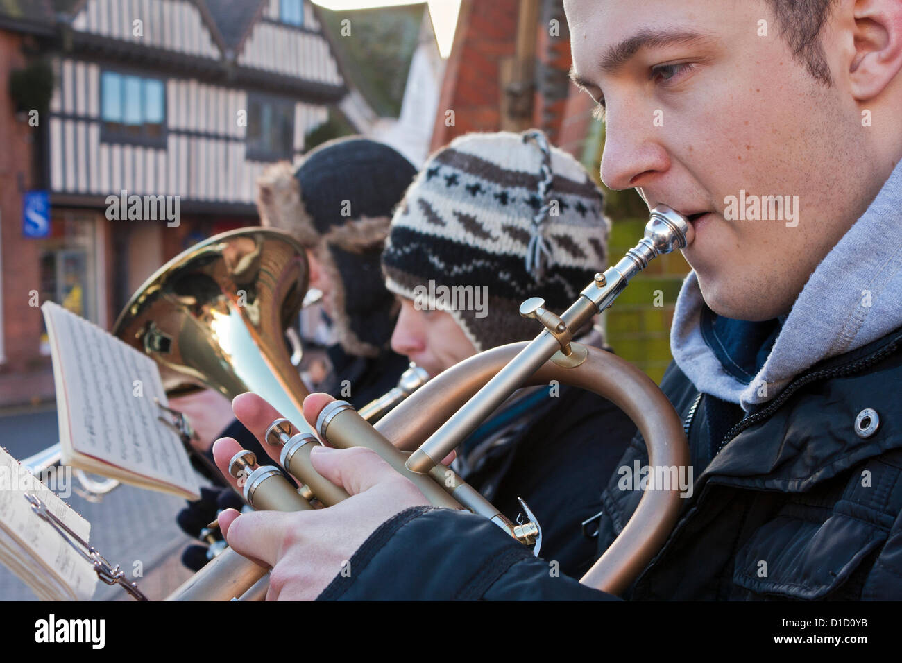 Street musicians play Christmas Carols outside Wokingham Town Hall in Berkshire, England. Stock Photo