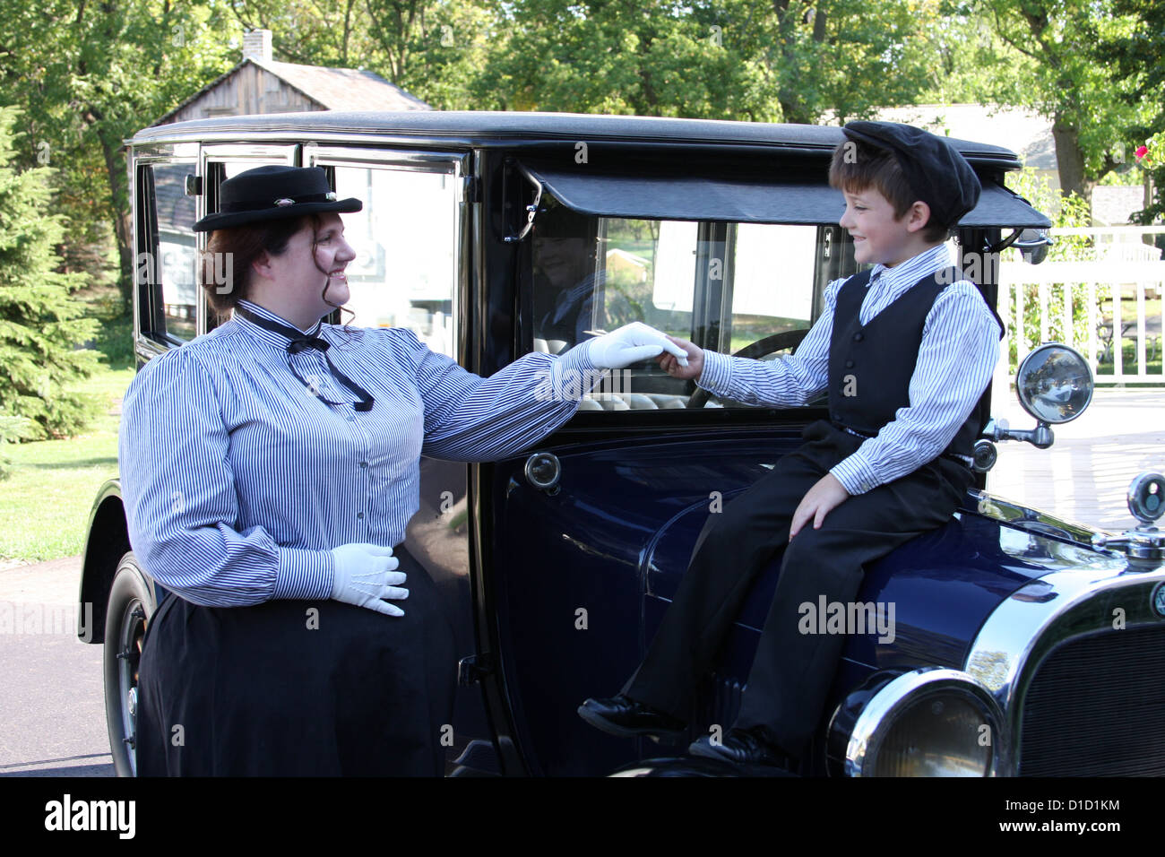 A young mother with her son on a Dodge Brothers 1925 car Stock Photo