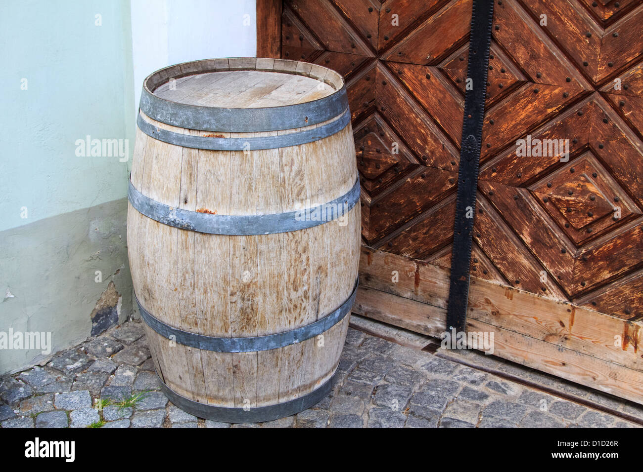 A vintage barrel in the corrner of a building Stock Photo