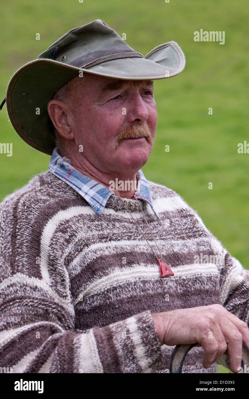 A New Zealand Sheep Herder (Musterer) near Masterton, north island, New Zealand. A dog whistle is on a string around his neck. Stock Photo