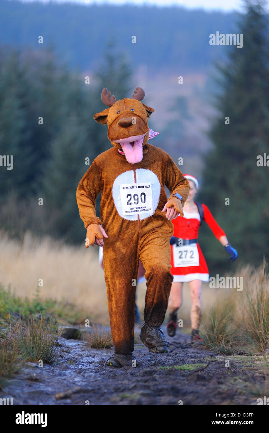 competitor in a christmas ' turkey trot ' trail race in reindeer costume Stock Photo