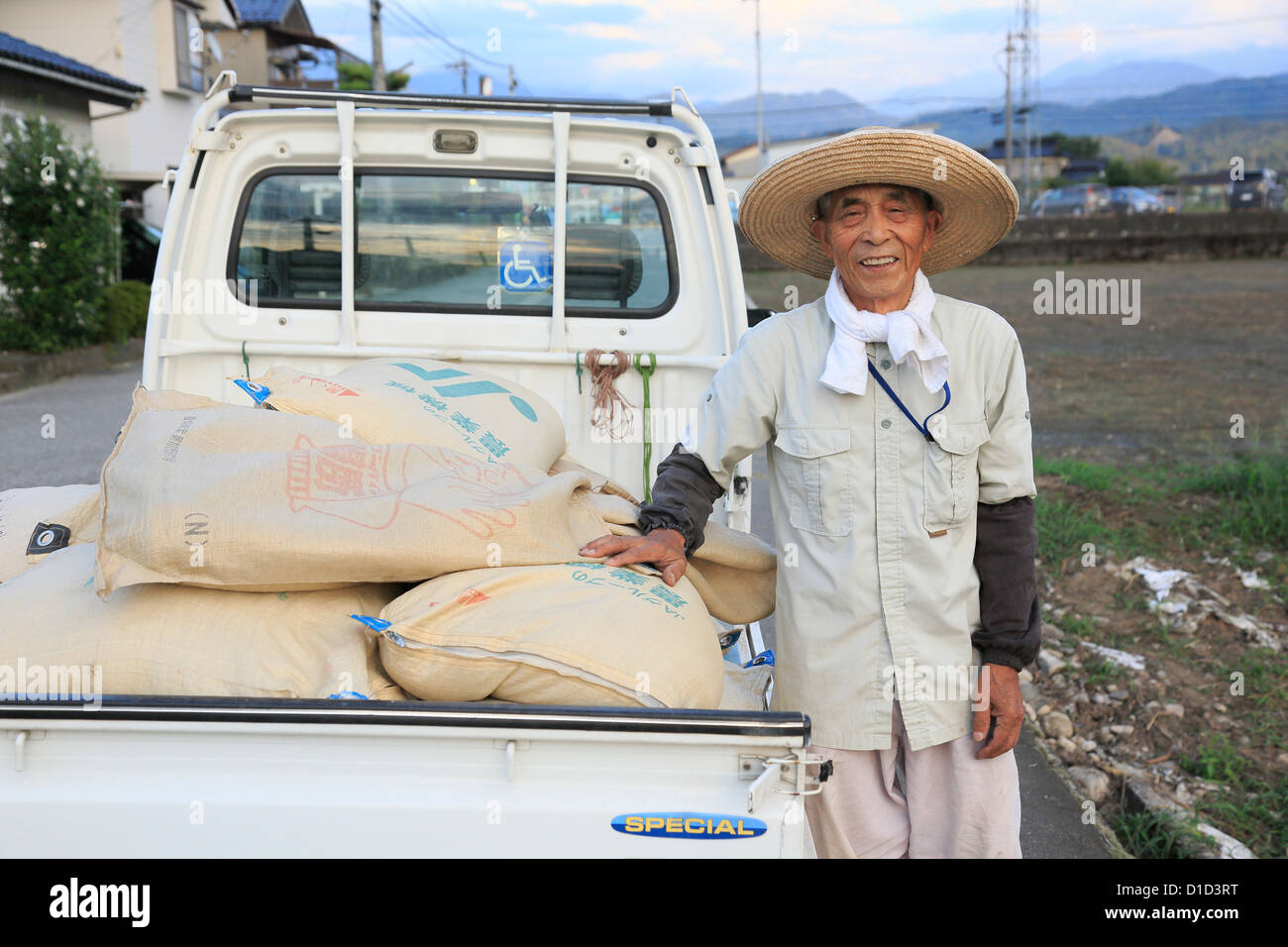 Farmer Standing Beside Truck Stock Photo - Alamy