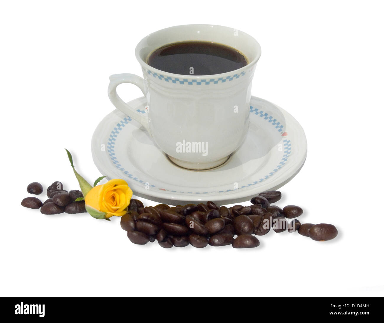 White cup and sauce with coffee in cup and coffee beans scattered around it - on a plain white background Stock Photo