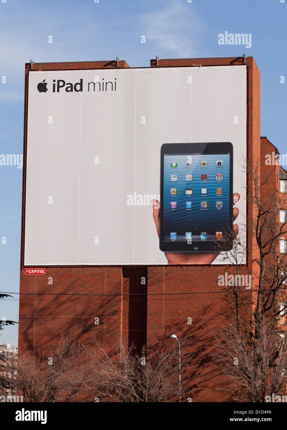 iPad mini ad on side of old brick building Stock Photo