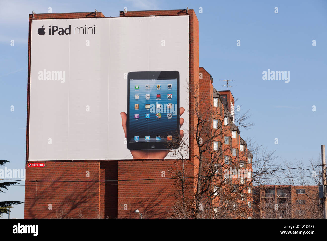 iPad mini ad on side of old brick building Stock Photo