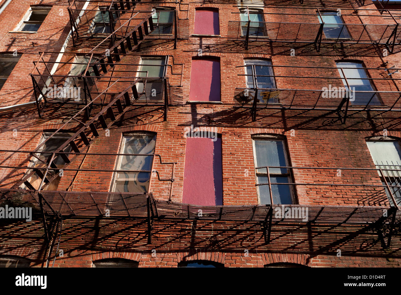 Fire escape stairs on an old brick apartment building Stock Photo