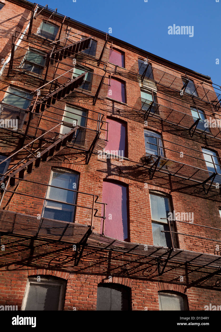 Fire escape stairs on an old brick apartment building Stock Photo