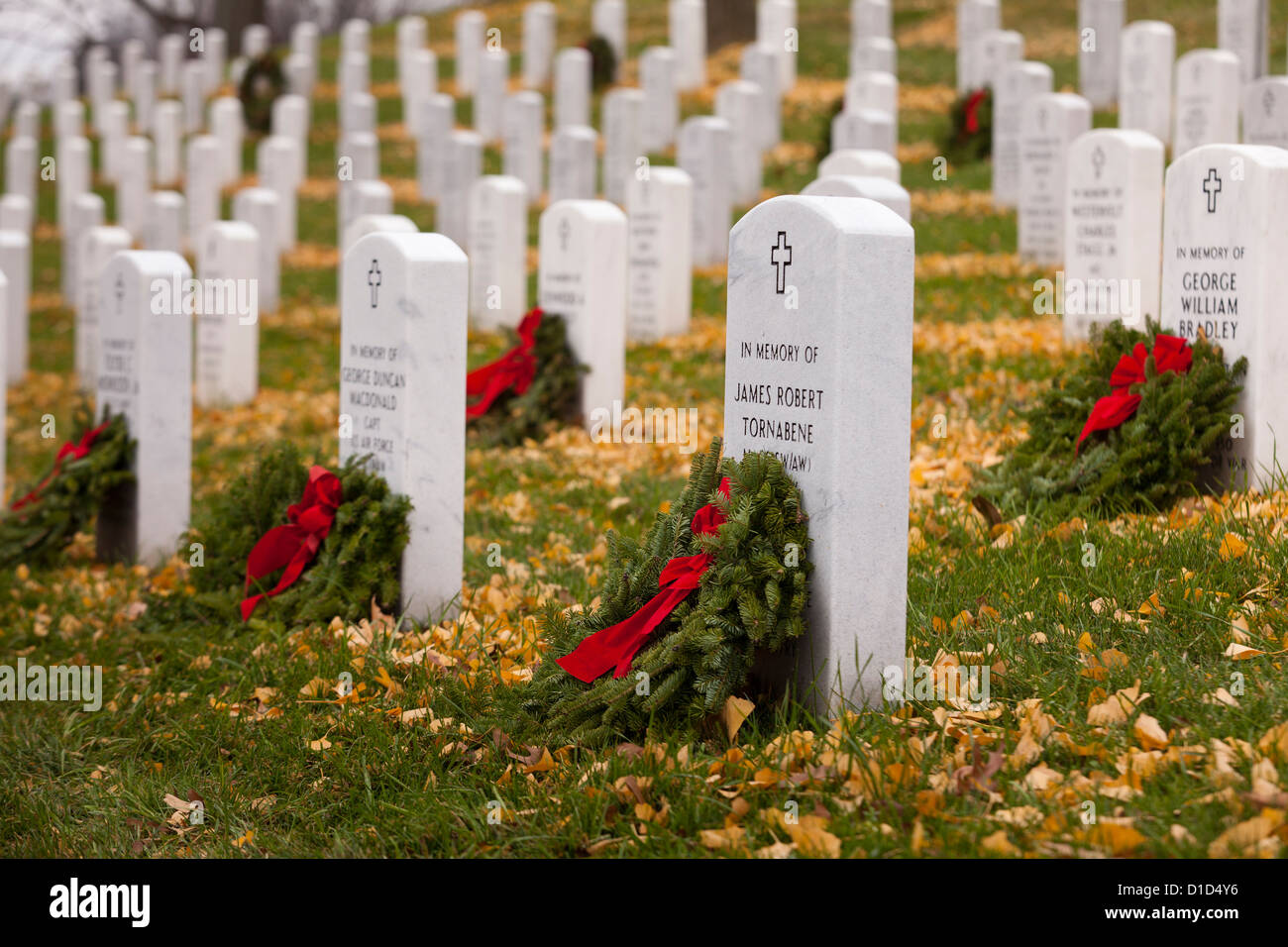 Christmas wreaths laid on headstones in Arlington National Cemetery - Washington, DC USA Stock Photo