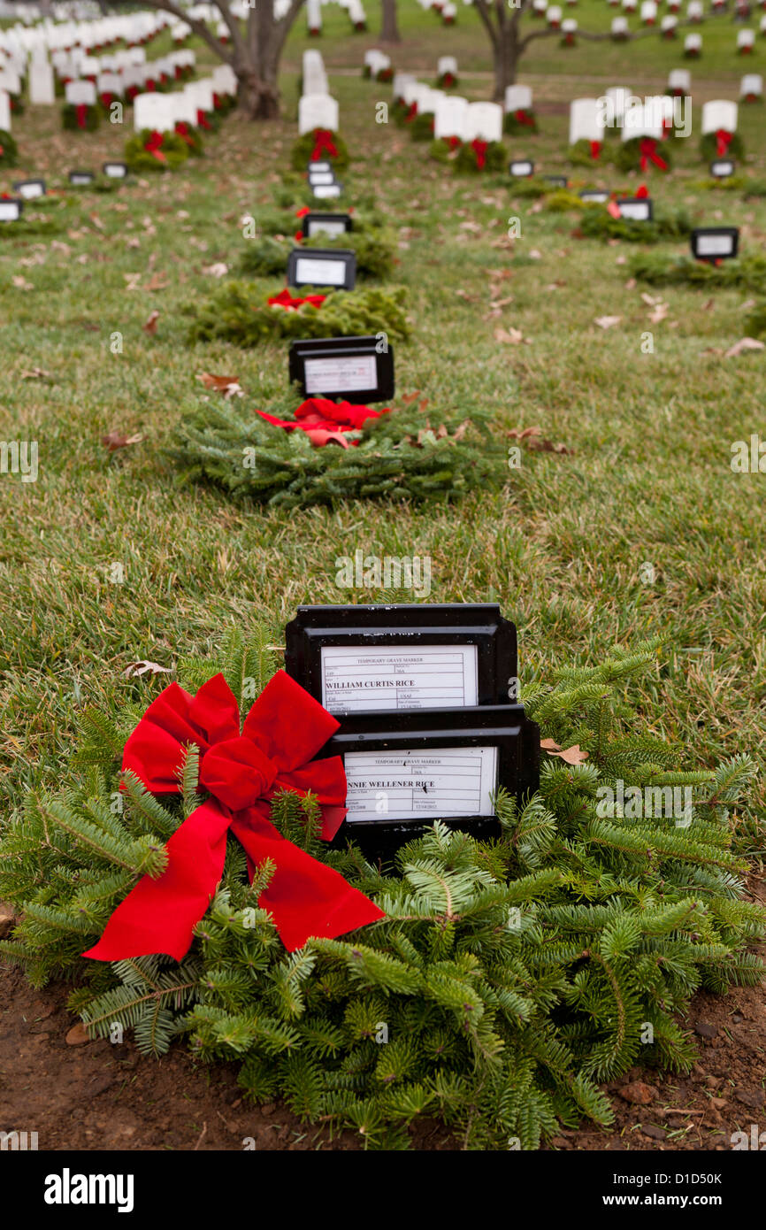 Christmas wreaths laid on headstones in Arlington National Cemetery - Washington, DC USA Stock Photo