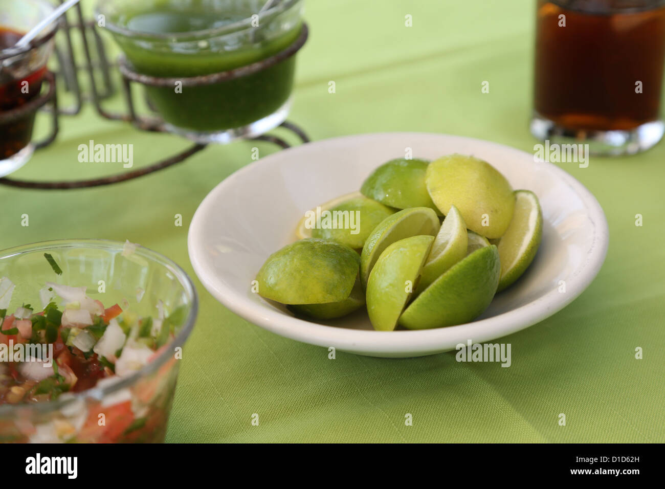 A bowl of limes and other condiments on a table in Punta de Mita, Nayarit, Mexico. Stock Photo