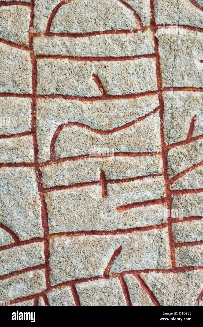 Old historic nordic runes engraved in stone. The stone is located at