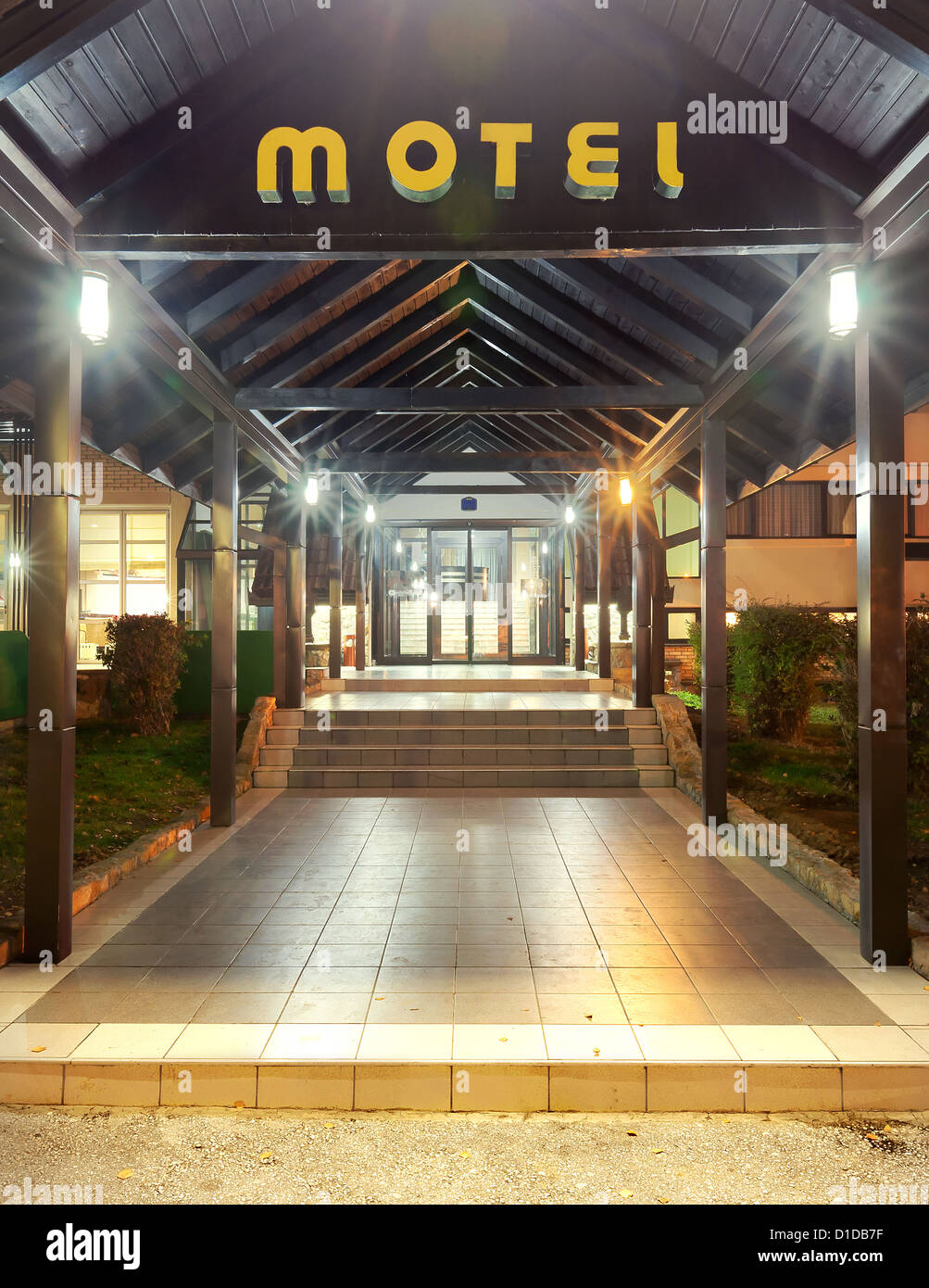 Entrance of a motel, night scene with lighting equipment, simple and classic. Stock Photo