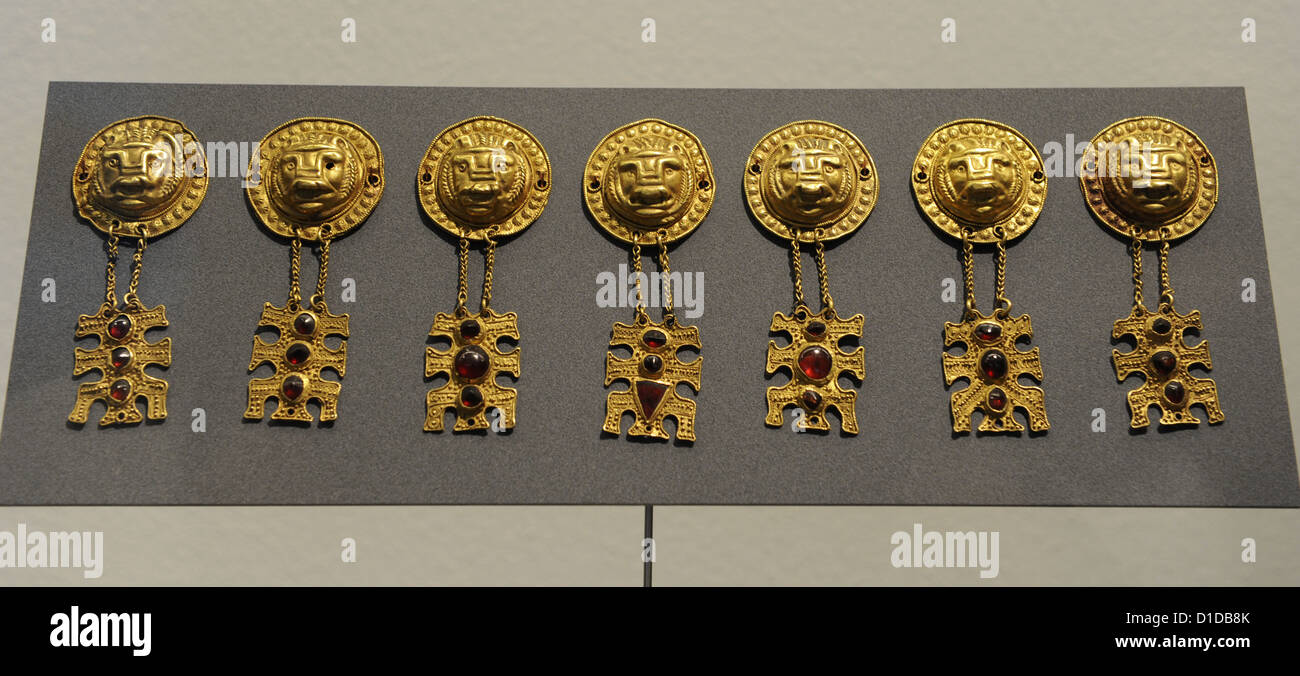 Metal Age. Gold ornaments with lions' head. Woman's grave from Arsley, Funen, 4th century. National Museum of Denmark. Stock Photo
