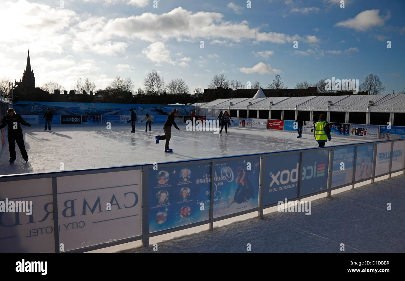 Ice skating on temporary mobile ice rink on Parkers Piece Cambridge