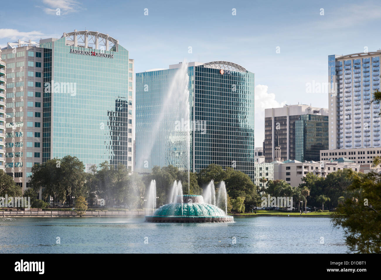 Modern high-rise buildings behind fountain in Lake Eola in downtown Orlando, Florida Stock Photo