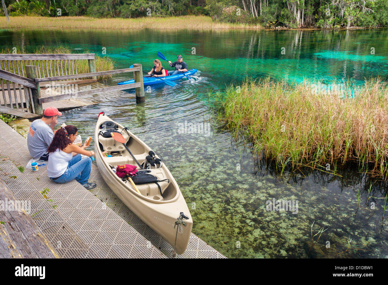 Kayakers stop for lunch along the Rainbow River in Dunnellon, Florida Stock Photo