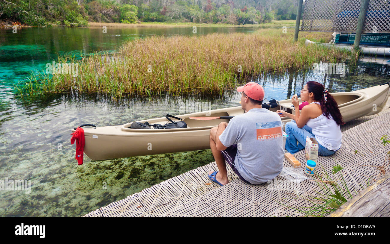 Kayaking couple stop for lunch along the spring fed Rainbow River in Dunnellon, Florida Stock Photo