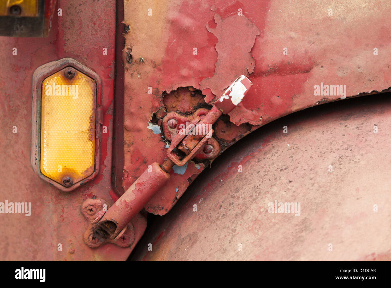 Detail of hood latch on old antique GMC truck with rust and oxidized paint Stock Photo