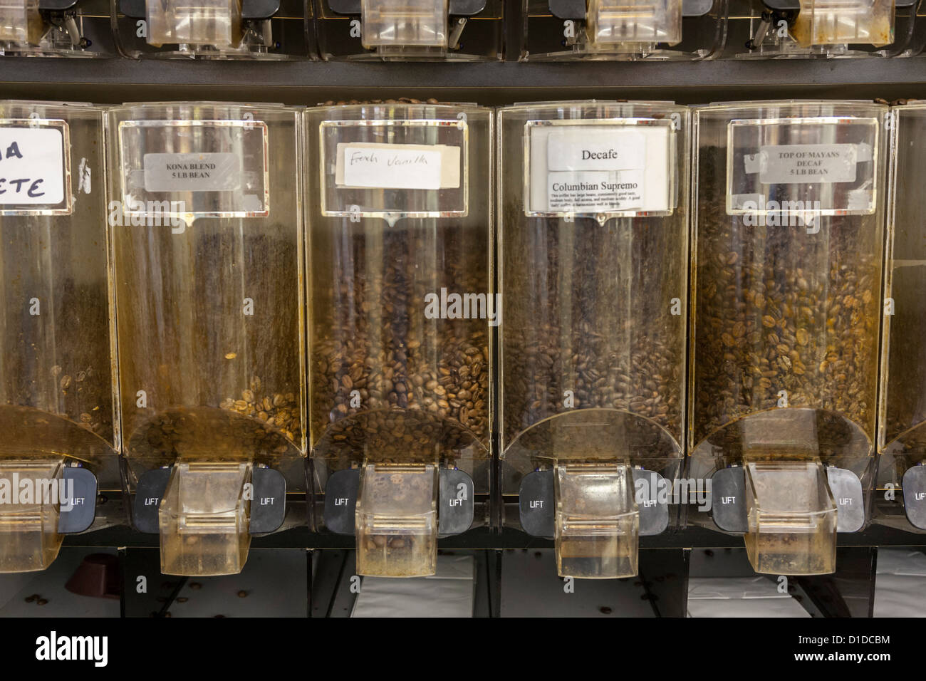 Coffee bean dispenser with several varieties of coffee beans Stock Photo