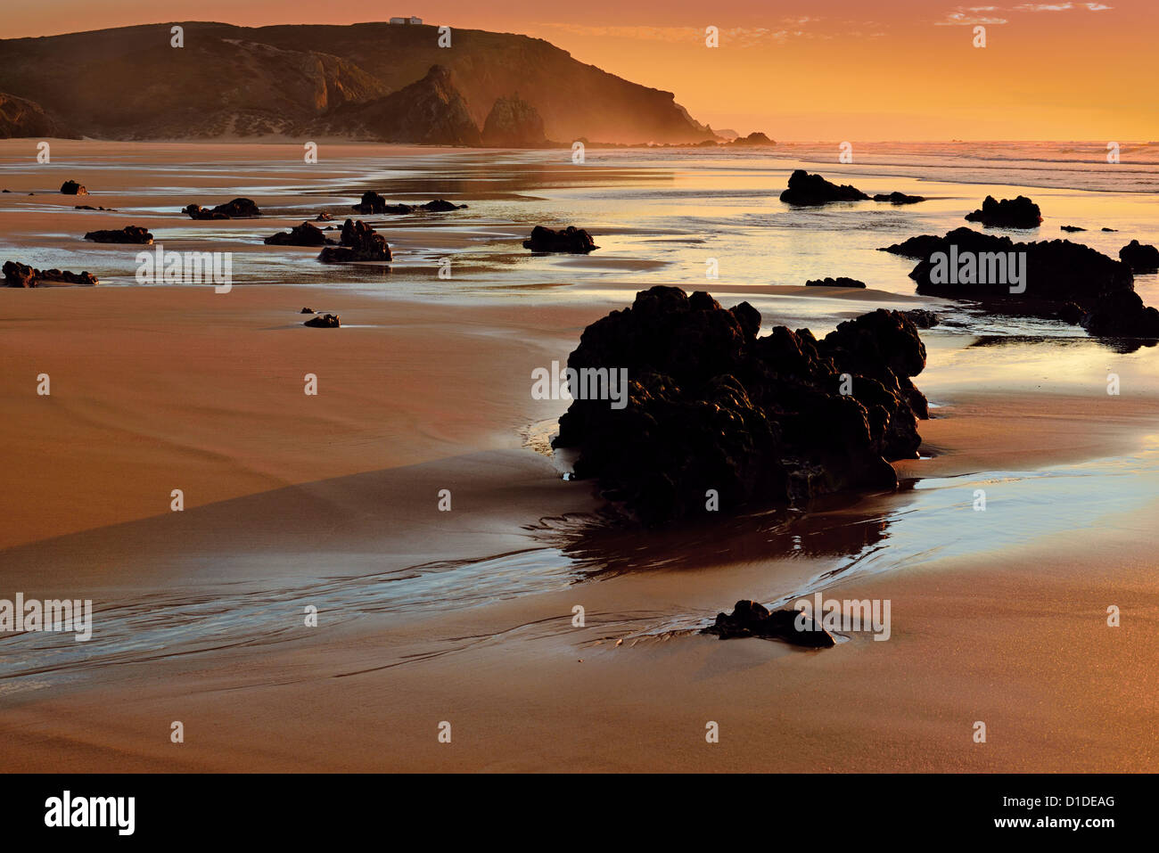 Portugal, Algarve: Romantic sunset at beach Praia do Amado Stock Photo
