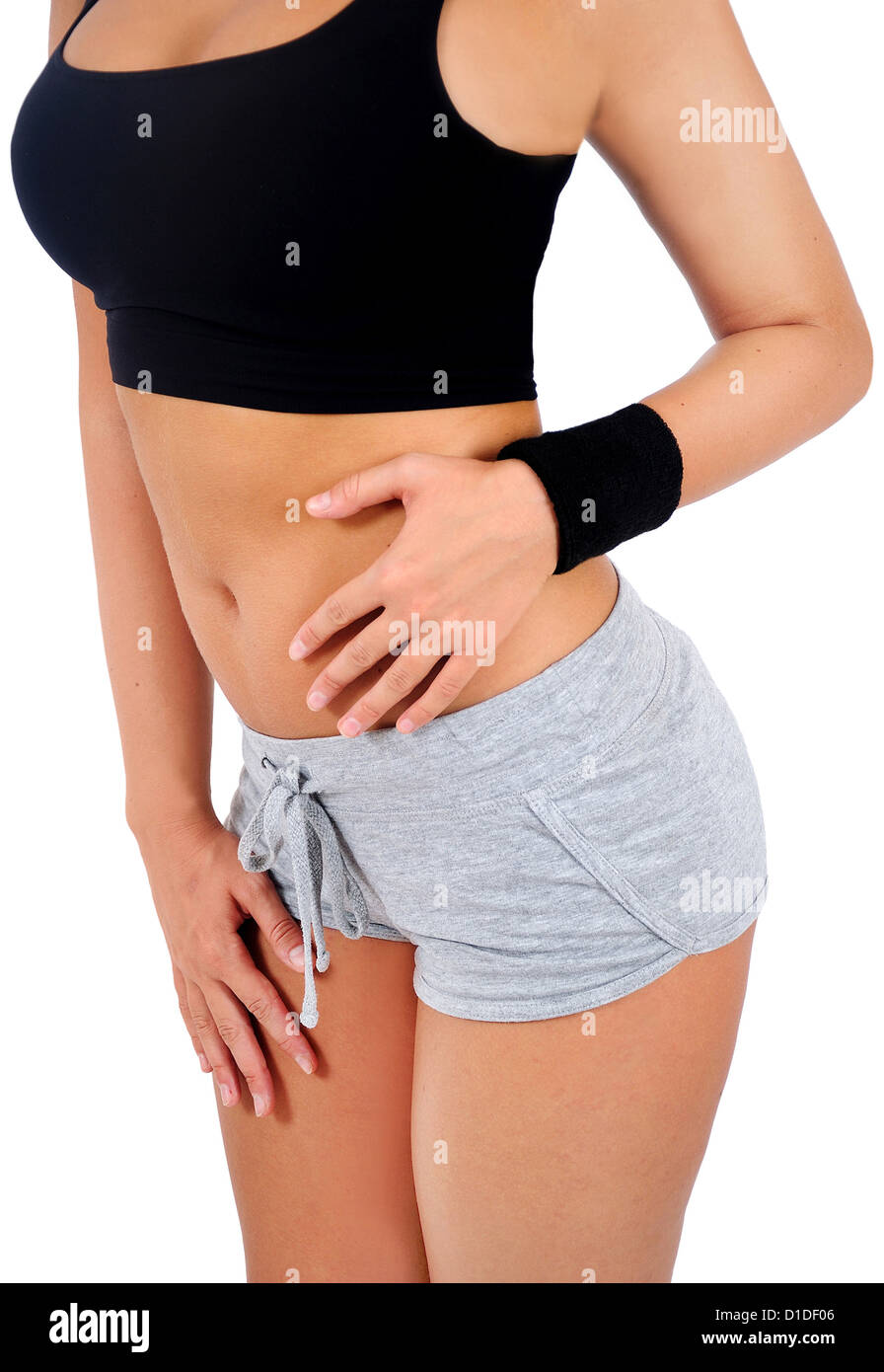 Isolated young fitness woman abdominal massage Stock Photo