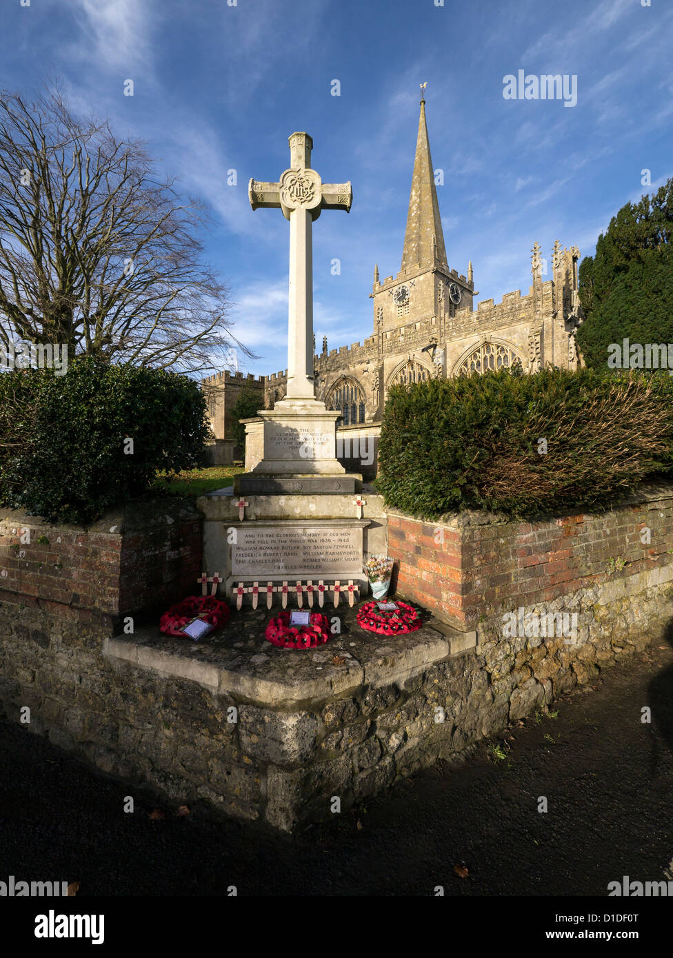 The Parish Church of St. Nicholas, Bromham (Parish of Bromham, Chittoe and Sandy Lane), with the War Memorial in front. Stock Photo