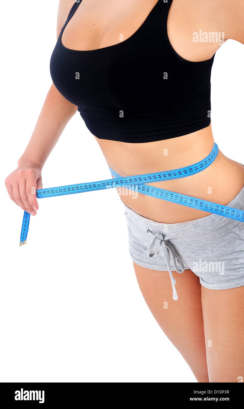 Isolated young fitness woman measurement Stock Photo