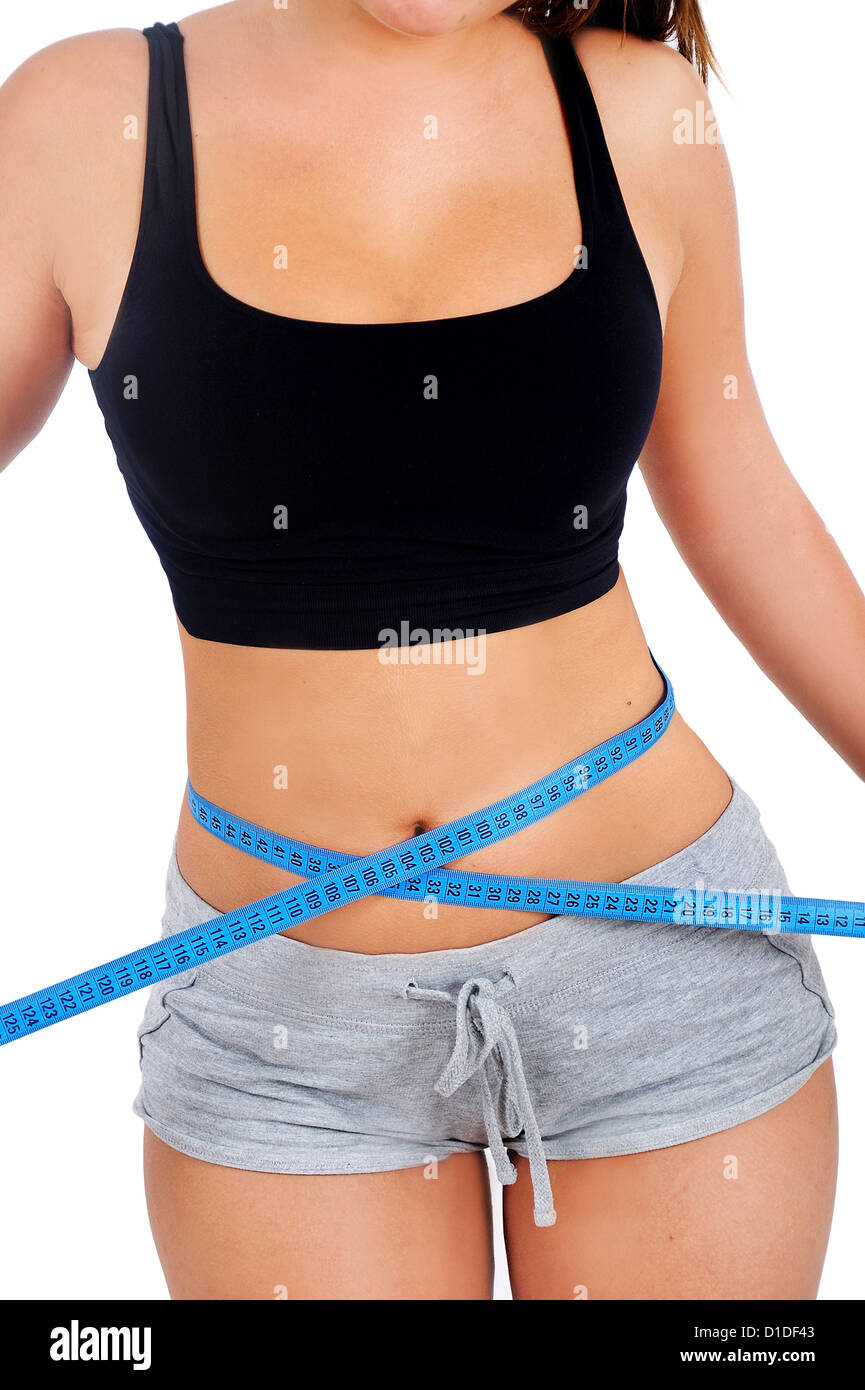 Isolated young fitness woman measure Stock Photo